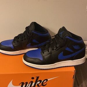 Women’s blue and black Nike mids